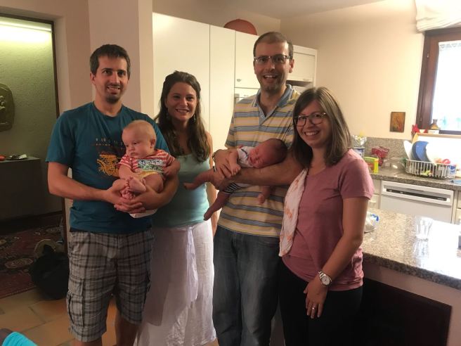 A group picture of the two new families after one year. 