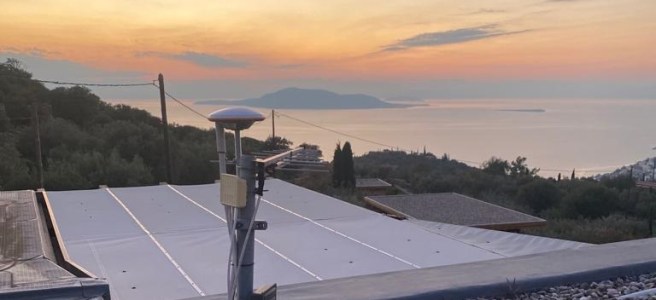 GEODNET receiver install on flat roof.